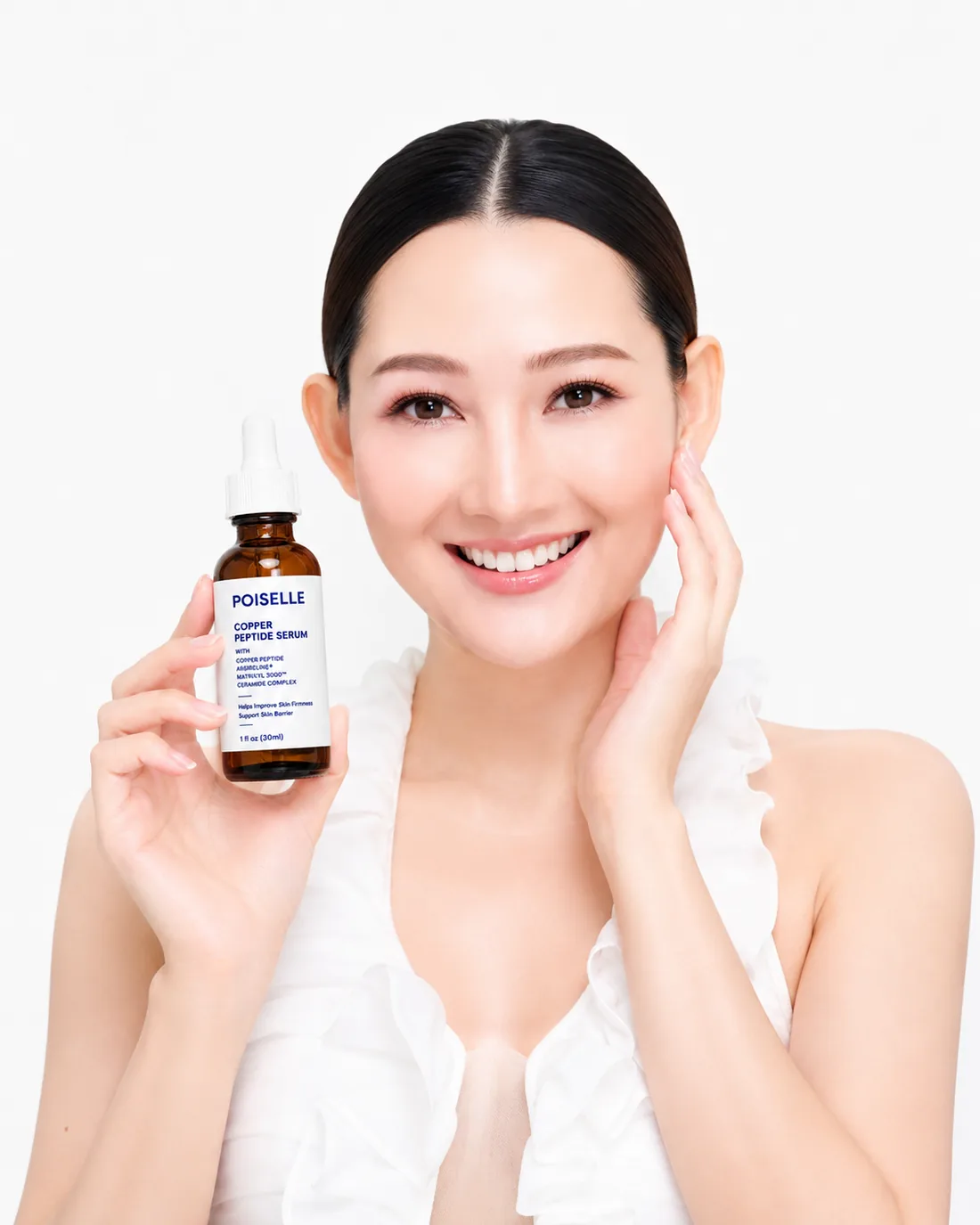 Model holding POISELLE Copper Peptide Serum